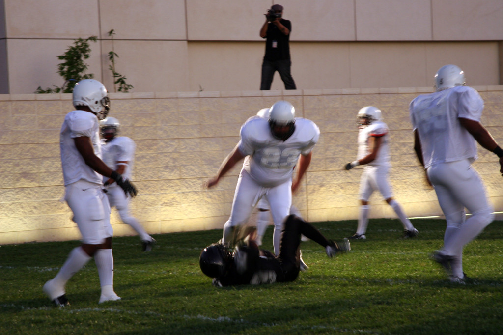 Bull in the Ring, 2008 Performance video - banned drill, Los Angeles County Museum of Art. Produced by Brad L Cooper WITH the players of LCFL semi-pro football Photo by Marshall Astor